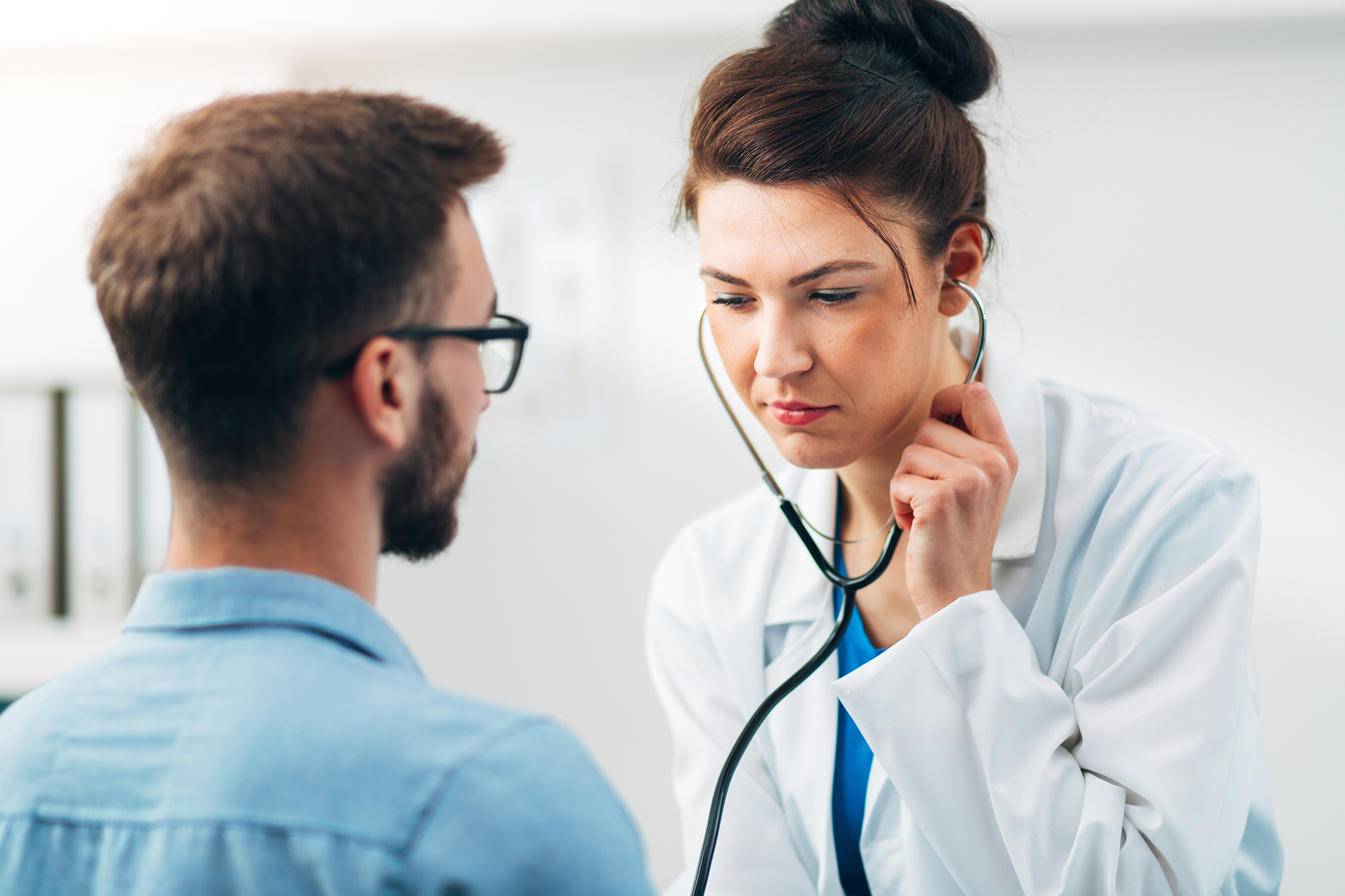 woman-doctor-performing-stethoscope-check-up